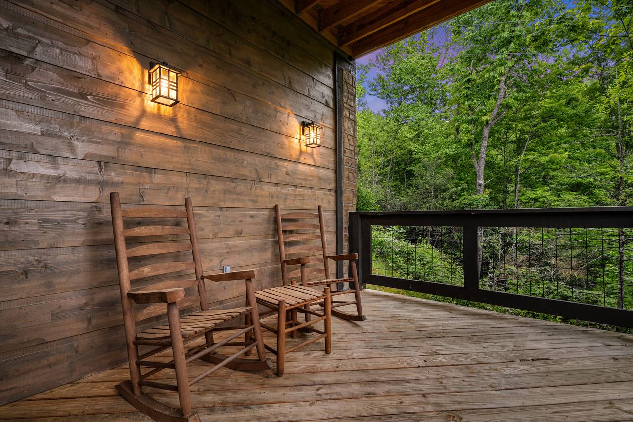 Unwind in a rocking chair on the peaceful front deck Unwind in a rocking chair on the peaceful front deck