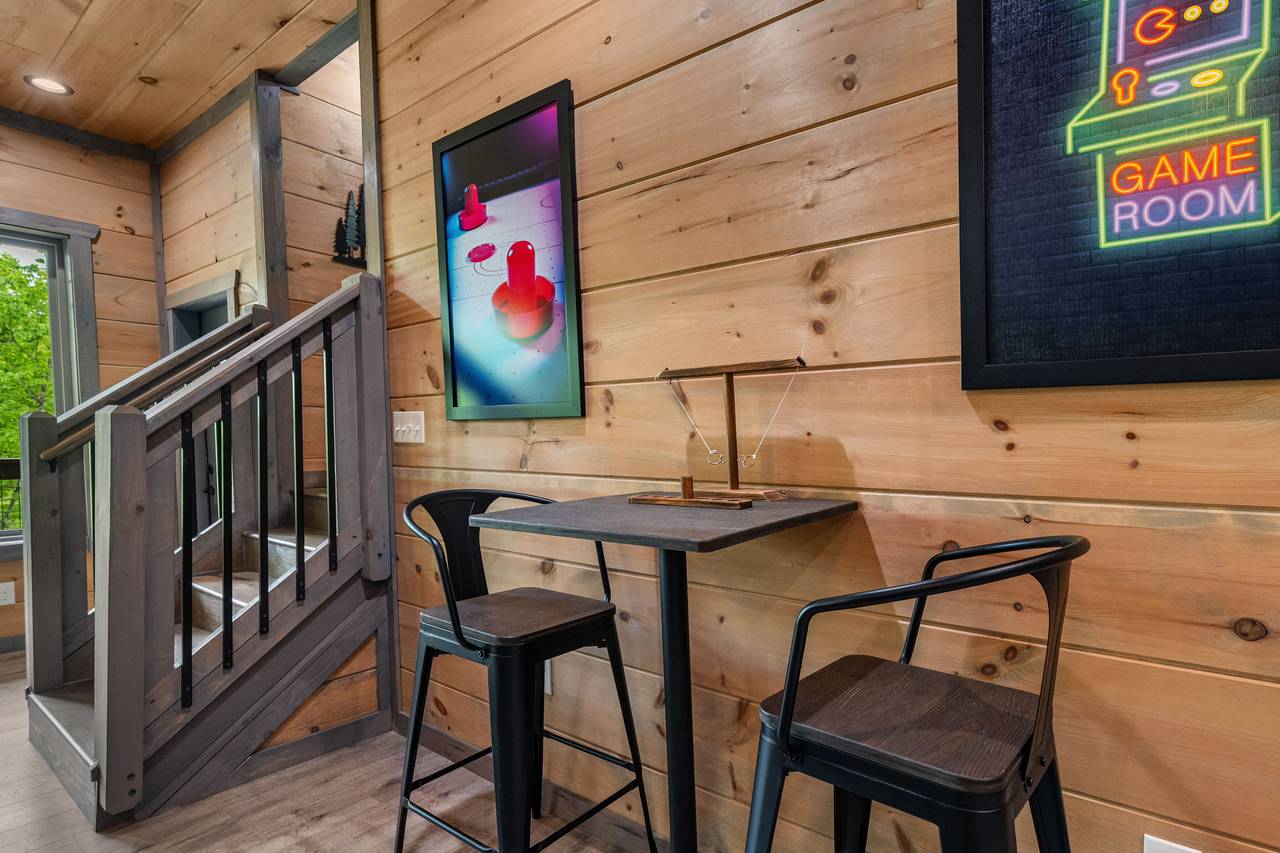 Lounge in style with a fireplace, wet bar, and cozy seating! Lounge in style with a fireplace, wet bar, and cozy seating!