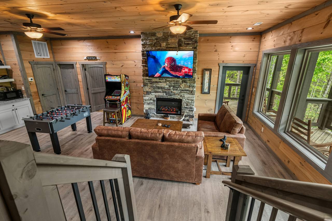 Lounge in style with a fireplace, wet bar, and cozy seating! Lounge in style with a fireplace, wet bar, and cozy seating!