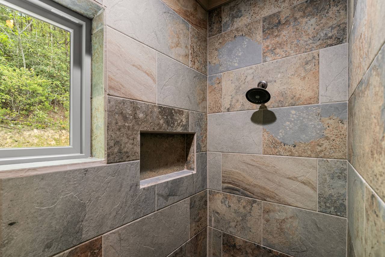 Private ensuite bath with sleek and spacious walk-in shower Private ensuite bath with sleek and spacious walk-in shower