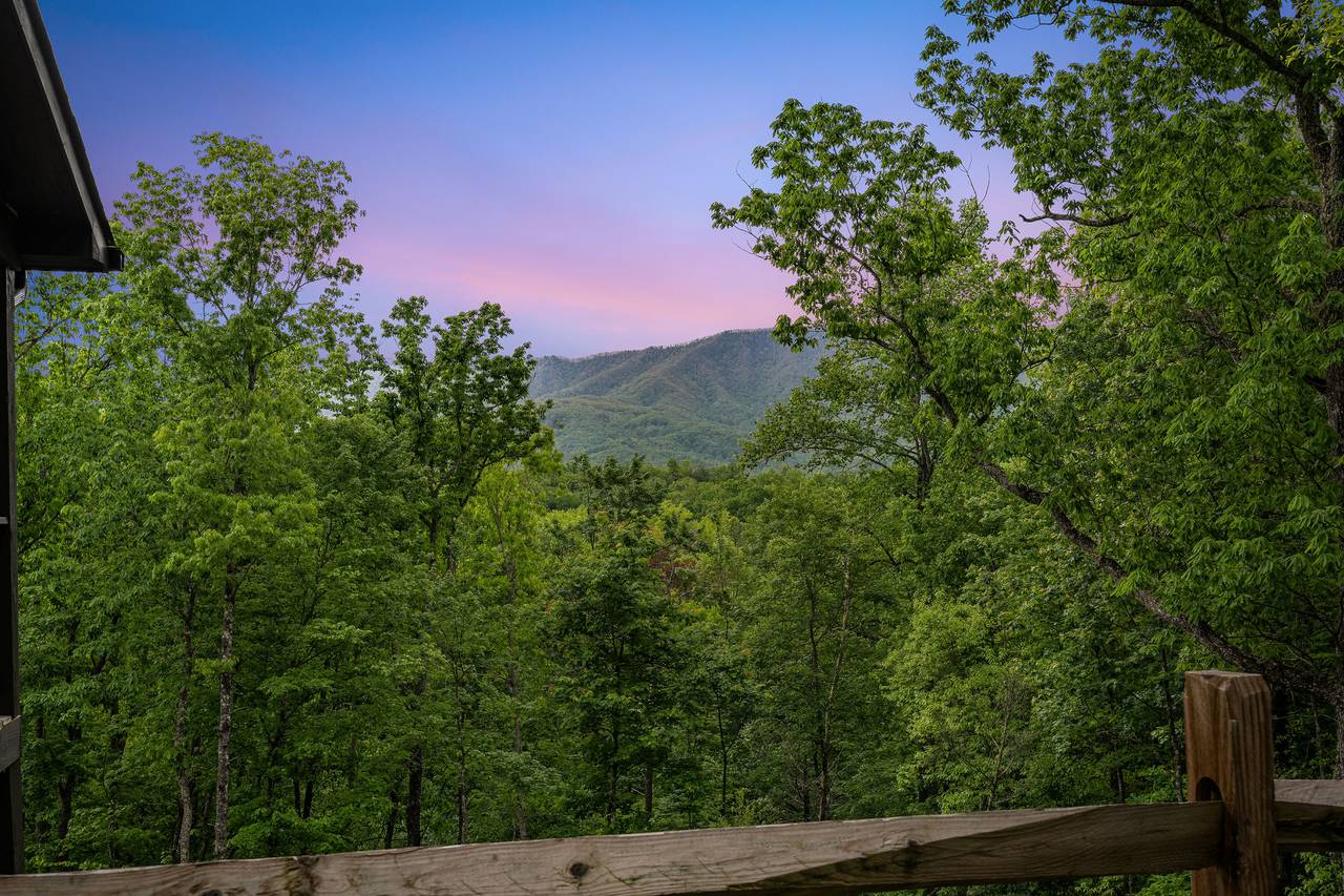 Relax on the deck with seating and Smoky Mountain views Relax on the deck with seating and Smoky Mountain views