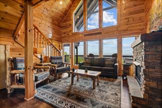 Cozy living area with fireplace & 65" smart TV Cozy living area with fireplace & 65" smart TV