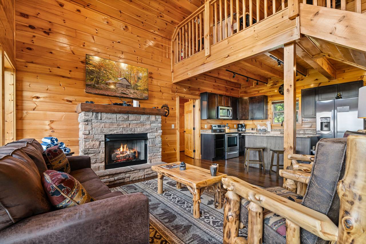 Cozy living area with fireplace & 65" smart TV Cozy living area with fireplace & 65" smart TV