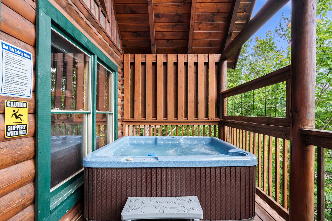 Relax in the outdoor hot tub with mountain views. Relax in the outdoor hot tub with mountain views.