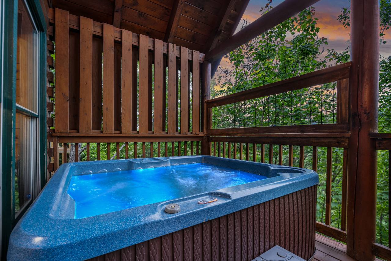 Relax in the outdoor hot tub with mountain views. Relax in the outdoor hot tub with mountain views.