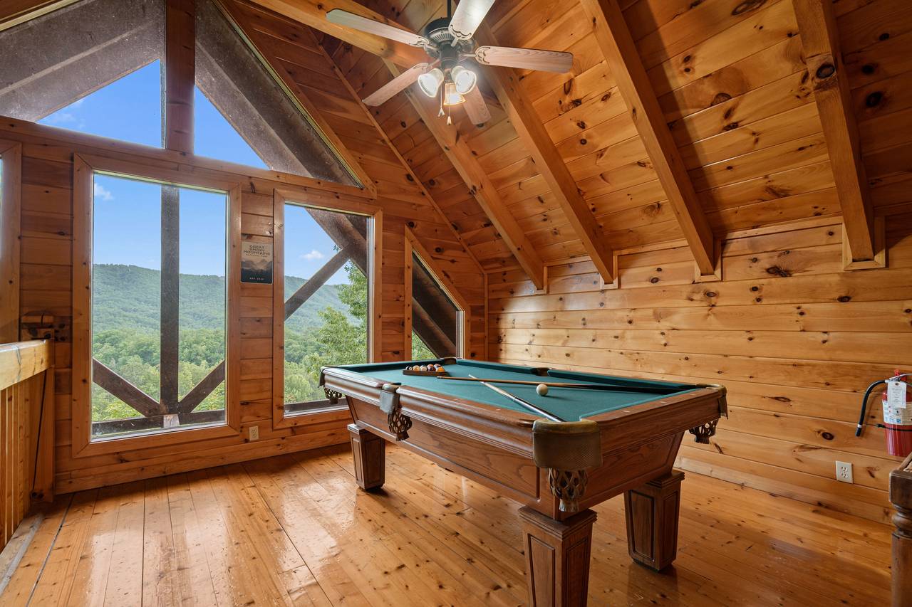 Enjoy a fun game of pool in the cabin’s game room. Enjoy a fun game of pool in the cabin’s game room.