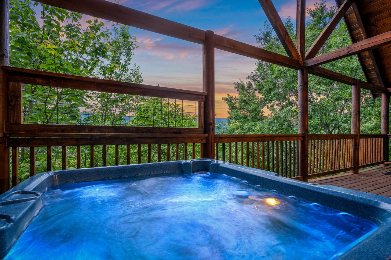 Relax in the outdoor hot tub with mountain views. Relax in the outdoor hot tub with mountain views.