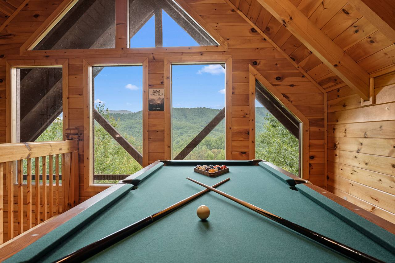 Enjoy a fun game of pool in the cabin’s game room. Enjoy a fun game of pool in the cabin’s game room.