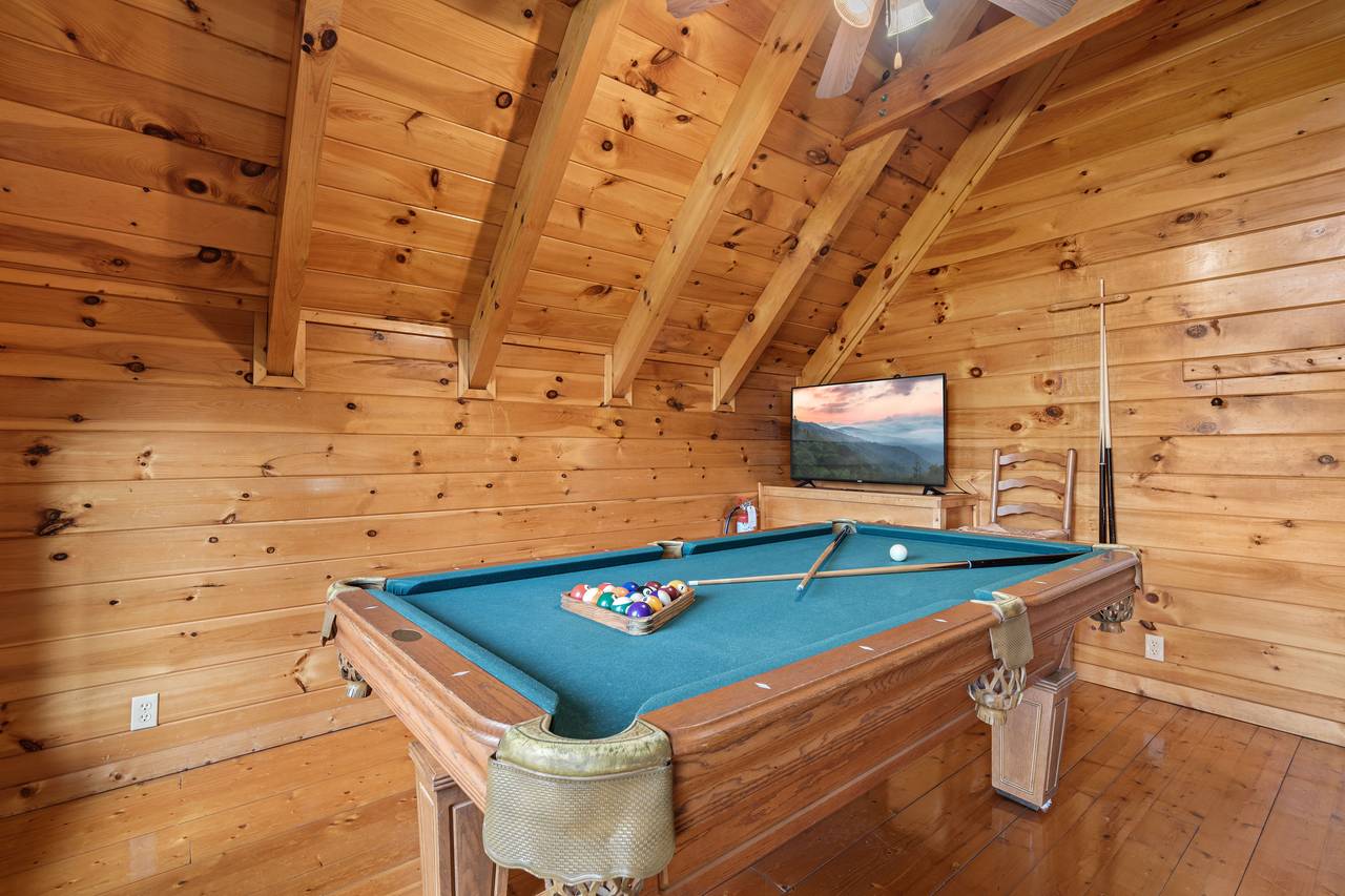 Enjoy a fun game of pool in the cabin’s game room. Enjoy a fun game of pool in the cabin’s game room.