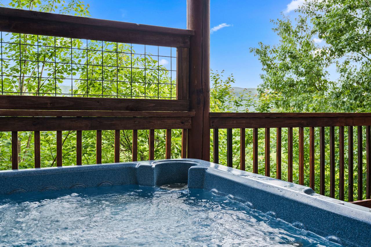 Relax in the outdoor hot tub with mountain views. Relax in the outdoor hot tub with mountain views.