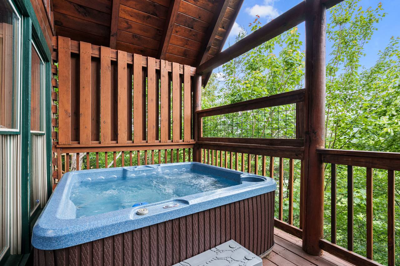 Relax in the outdoor hot tub with mountain views. Relax in the outdoor hot tub with mountain views.