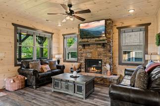 <span class="name">Spacious living room with plush seating & fireplace</span> <span class="name">Spacious living room with plush seating & fireplace</span>