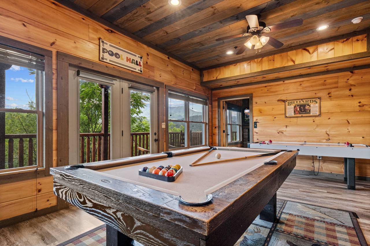 <span class="name">Lower level game room: Pool Table and Air Hockey Table</span> <span class="name">Lower level game room: Pool Table and Air Hockey Table</span>