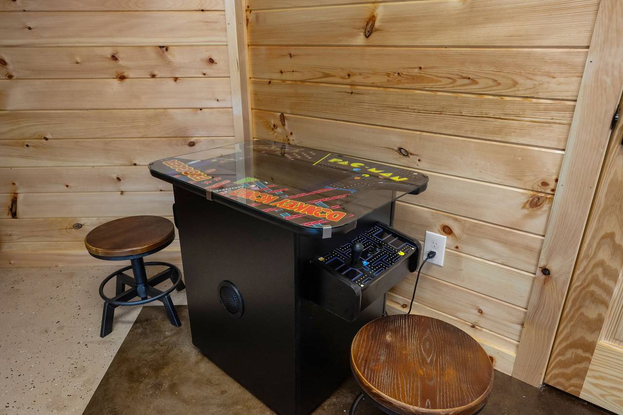 Game room with arcade, foosball & shuffleboard Game room with arcade, foosball & shuffleboard