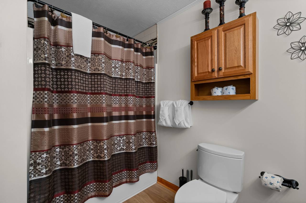 Shared full bath with tub/shower combo Shared full bath with tub/shower combo