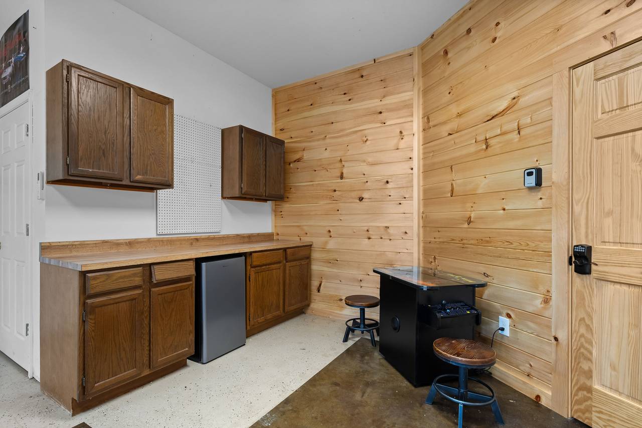 Game room with arcade, foosball & shuffleboard Game room with arcade, foosball & shuffleboard