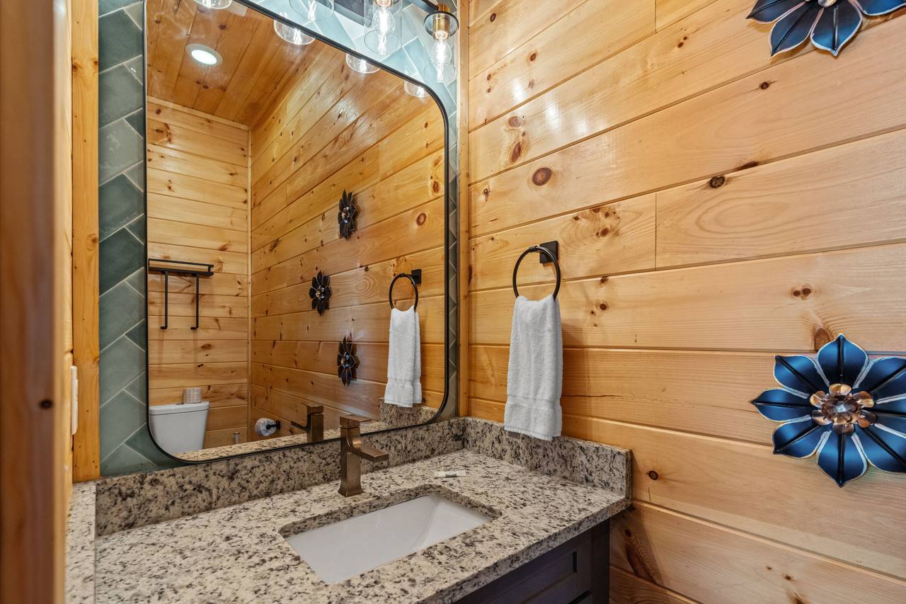 <span class="name">Outdoor half bath adds convenience by the pool area</span> <span class="name">Outdoor half bath adds convenience by the pool area</span>