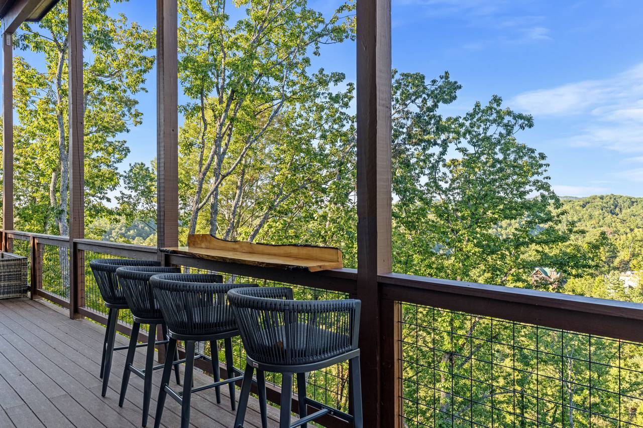 <span class="name">Ledge bar with stools overlooking the Smoky Mountains</span> <span class="name">Ledge bar with stools overlooking the Smoky Mountains</span>