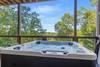 Hot tub under covered deck for year-round enjoyment Hot tub under covered deck for year-round enjoyment