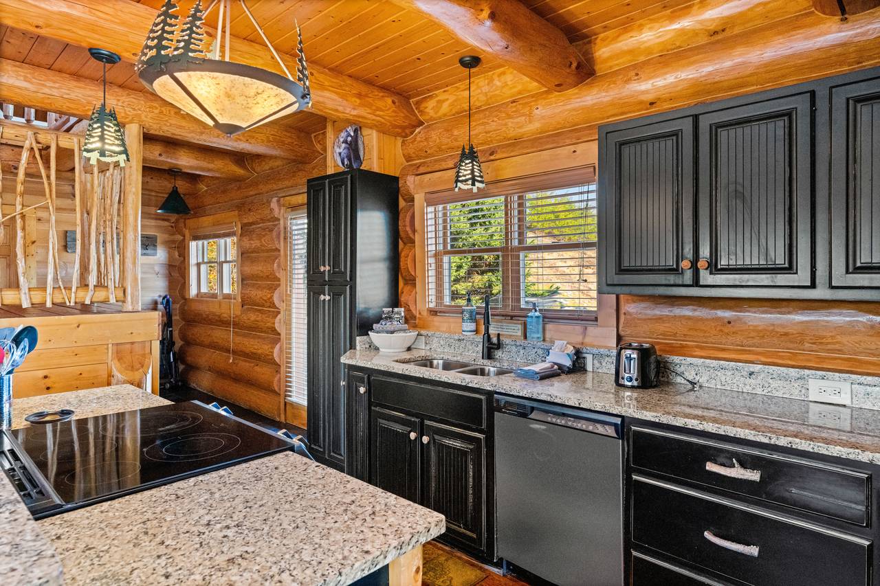 <span class="name">Kitchen with rustic cabinetry & stainless appliances</span> <span class="name">Kitchen with rustic cabinetry & stainless appliances</span>