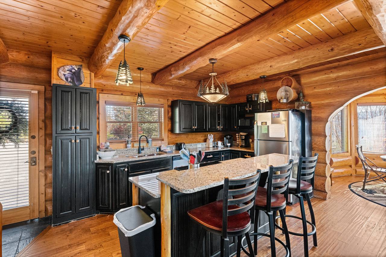 <span class="name">Kitchen with rustic cabinetry & stainless appliances</span> <span class="name">Kitchen with rustic cabinetry & stainless appliances</span>
