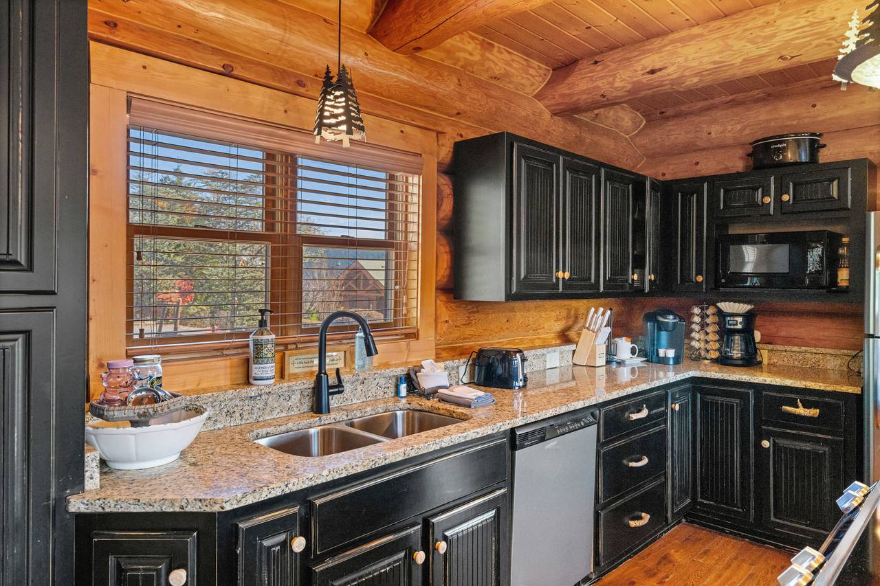 <span class="name">Kitchen with rustic cabinetry & stainless appliances</span> <span class="name">Kitchen with rustic cabinetry & stainless appliances</span>