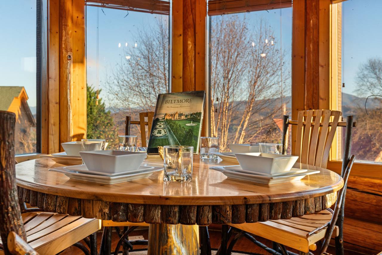 <span class="name">Dining knook with custom log table and chairs</span> <span class="name">Dining knook with custom log table and chairs</span>