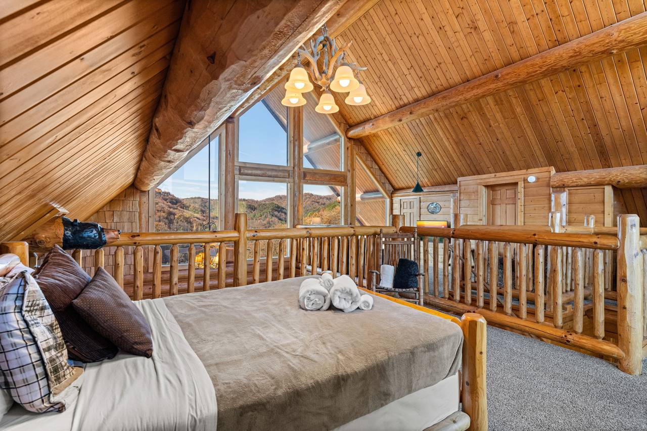 <span class="name">Loft queen bed with rustic décor & open treetop views</span> <span class="name">Loft queen bed with rustic décor & open treetop views</span>