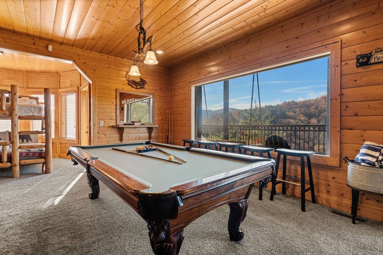 <span class="name">Game room with pool table & cozy lodge-style décor</span> <span class="name">Game room with pool table & cozy lodge-style décor</span>