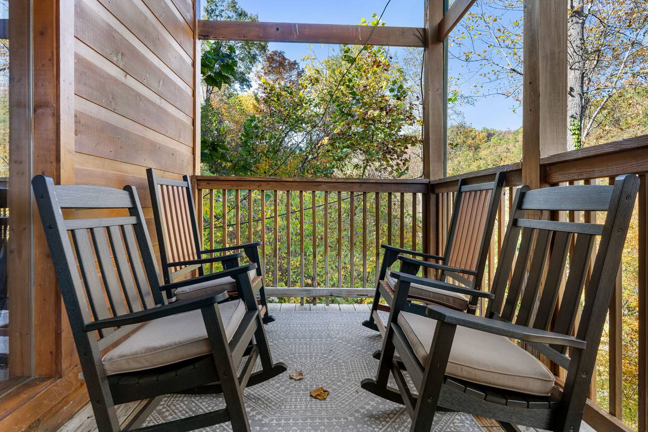 Rocking chairs & porch swing with peaceful forest views Rocking chairs & porch swing with peaceful forest views
