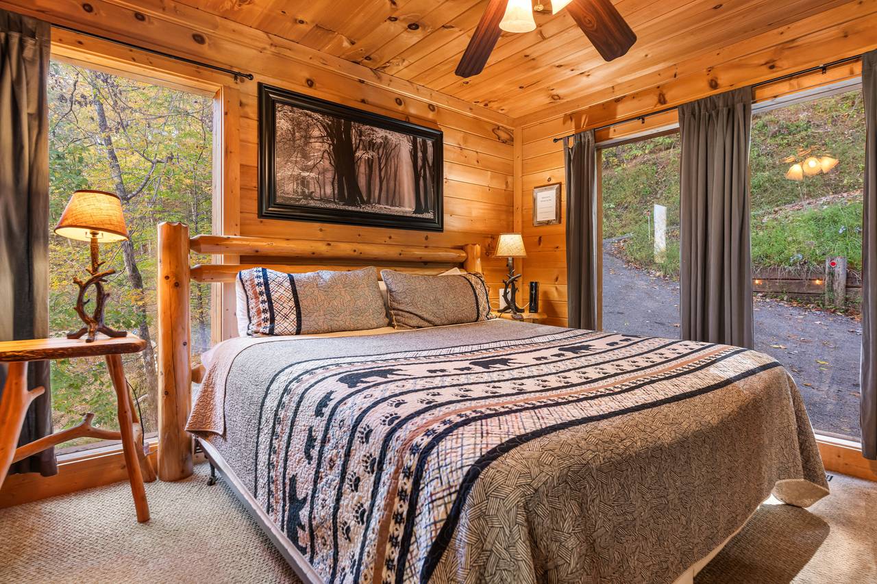 Main-level king bedroom with TV and ensuite full bath Main-level king bedroom with TV and ensuite full bath
