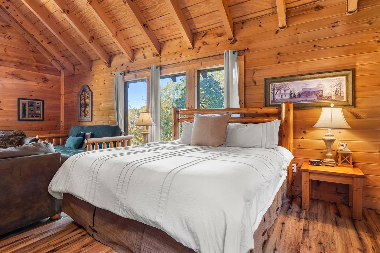 Upper king bedroom with futon, sleeper sofa & jetted tub Upper king bedroom with futon, sleeper sofa & jetted tub