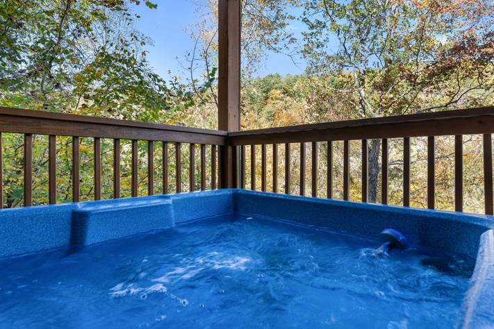 Relax in the bubbling hot tub beneath the stars Relax in the bubbling hot tub beneath the stars
