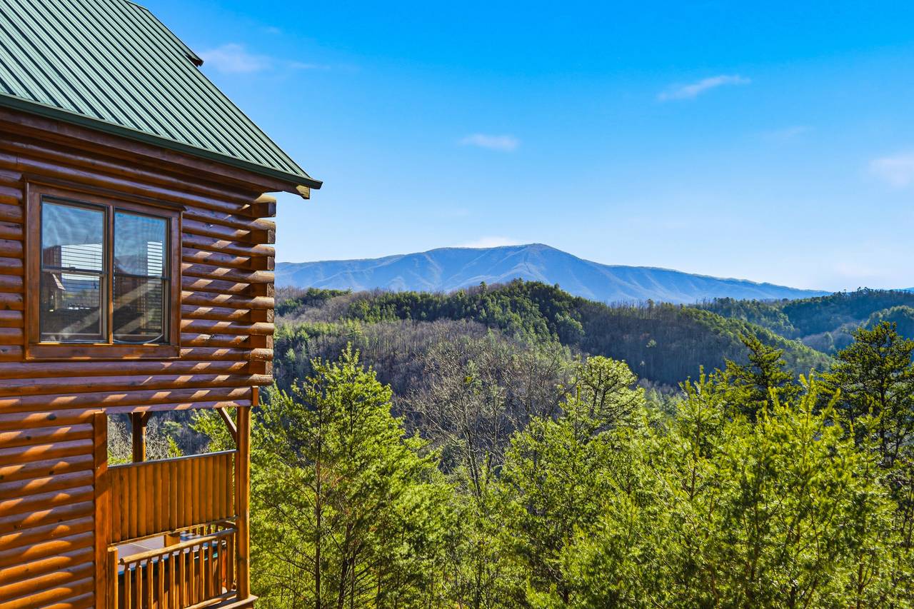 <span class="name">Cabin exterior with scenic mountain backdrop</span> <span class="name">Cabin exterior with scenic mountain backdrop</span>