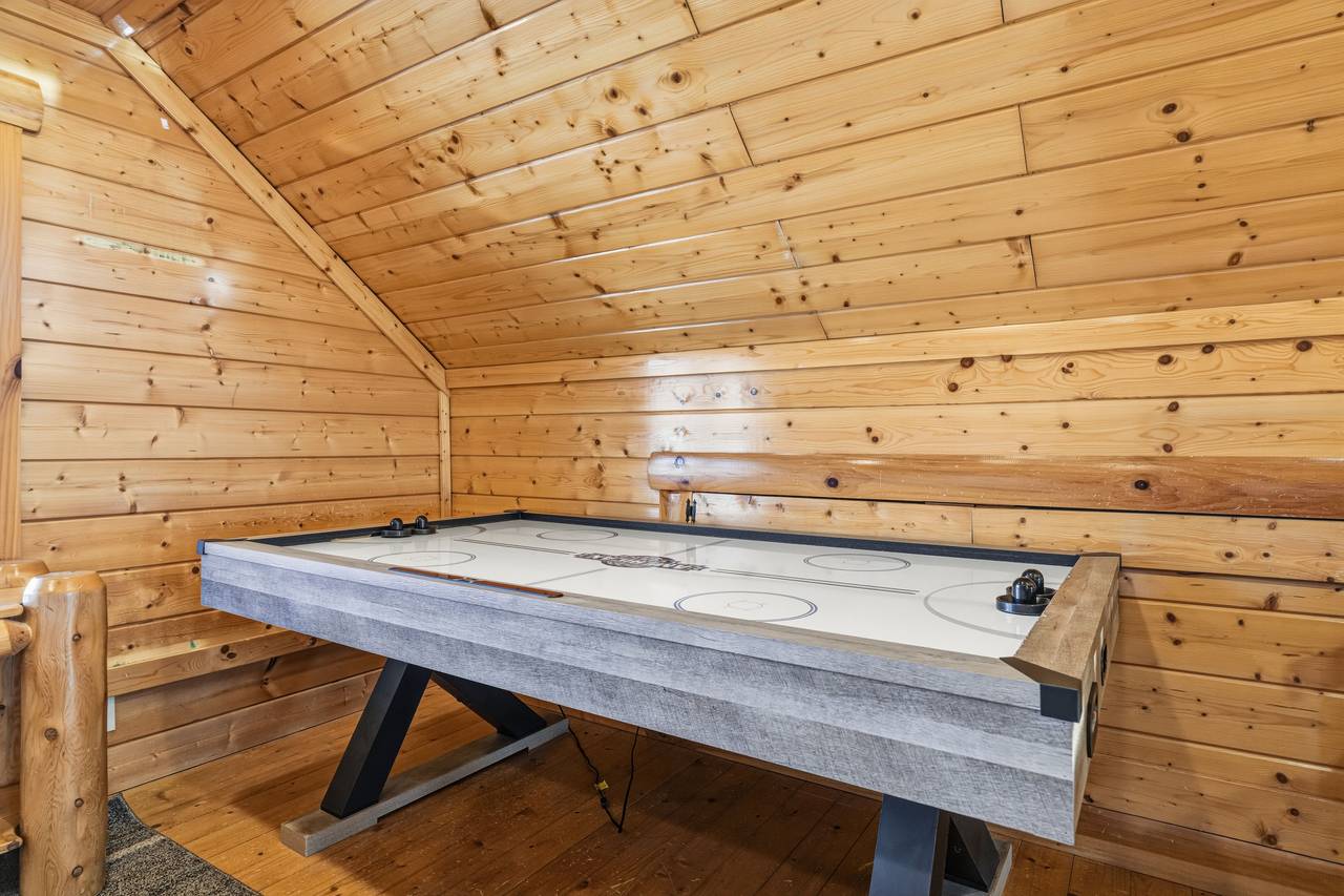 <span class="name">Loft bedroom with two queen beds, seating area, & air hockey</span> <span class="name">Loft bedroom with two queen beds, seating area, & air hockey</span>