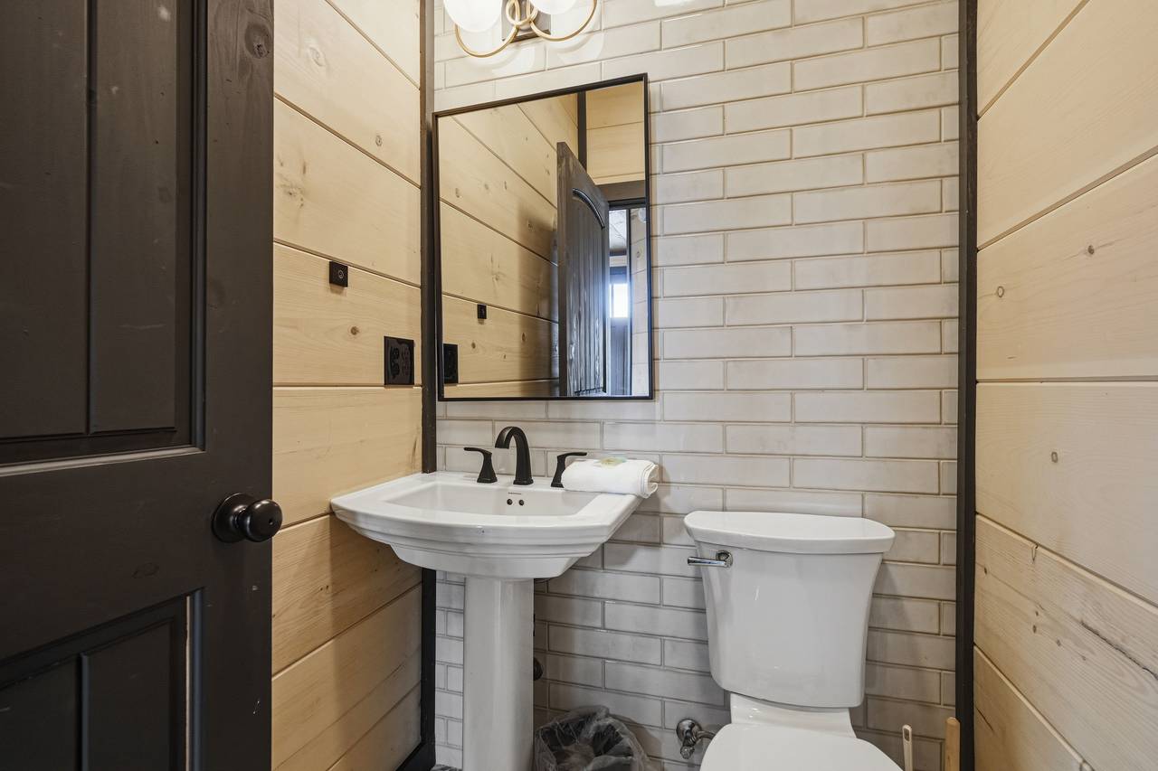 <span class="name">Half bathroom with vanity on main level</span> <span class="name">Half bathroom with vanity on main level</span>
