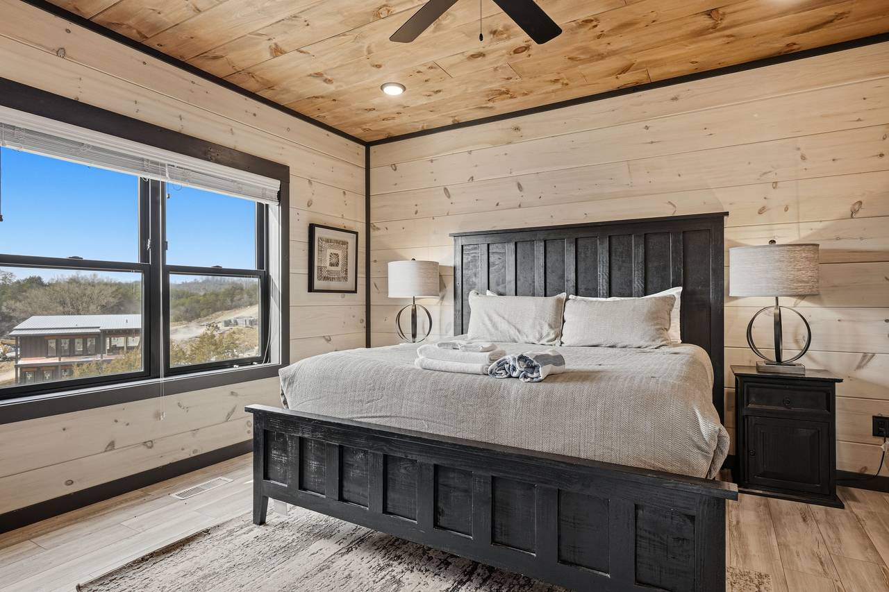 <span class="name">Bedroom 1 – main level king suite with Roku TV & work space</span> <span class="name">Bedroom 1 – main level king suite with Roku TV & work space</span>