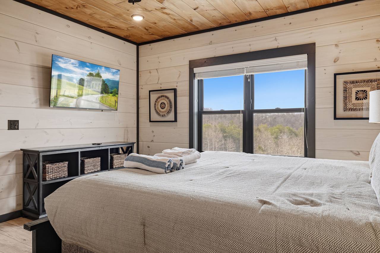 <span class="name">Bedroom 1 – main level king suite with Roku TV & work space</span> <span class="name">Bedroom 1 – main level king suite with Roku TV & work space</span>