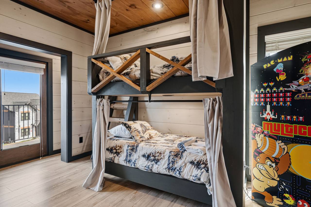 <span class="name">Game room bunk area with twin-over-twin bunk beds</span> <span class="name">Game room bunk area with twin-over-twin bunk beds</span>