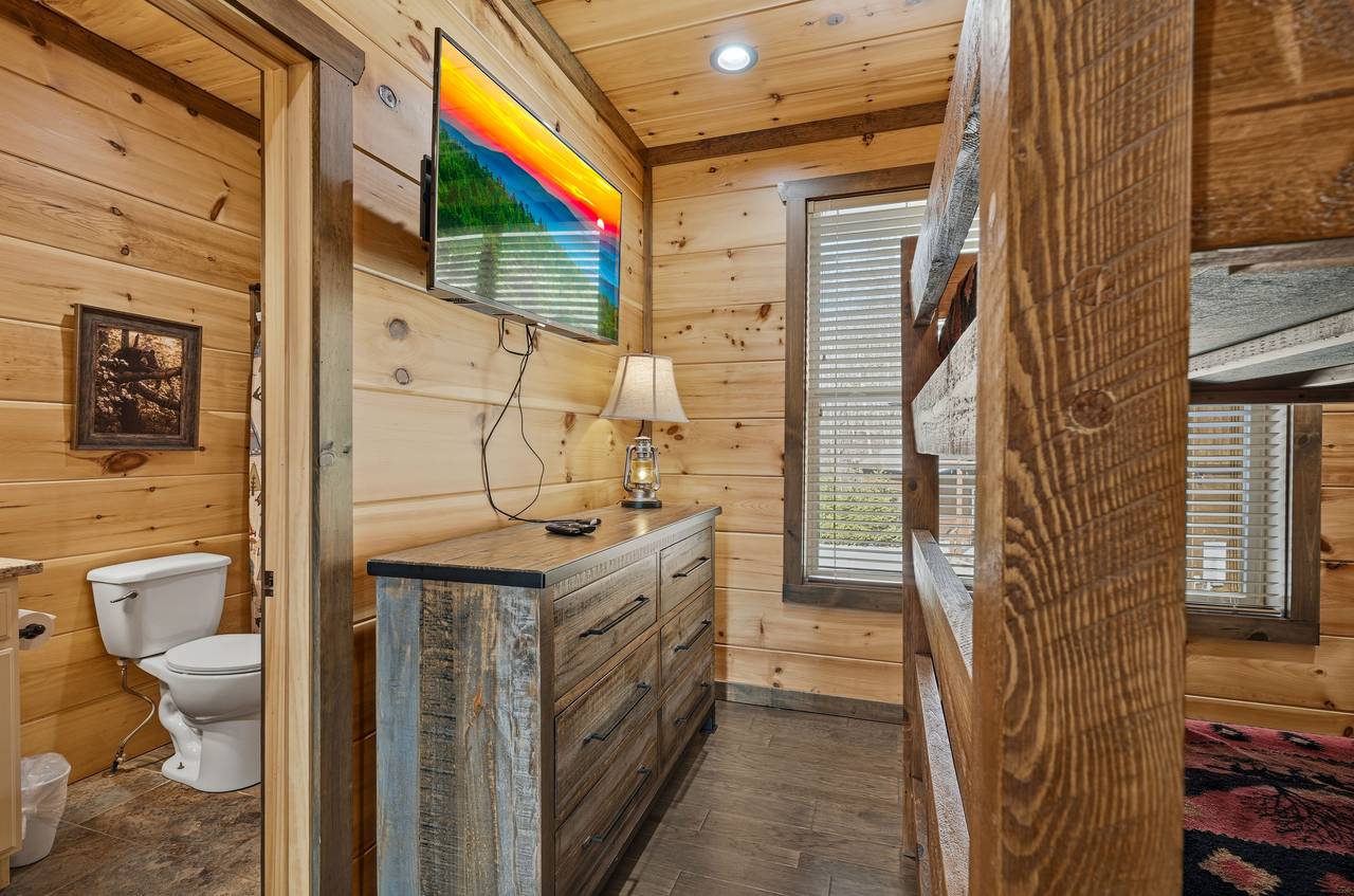 <span class="name">Upper-level queen over queen bunk with TV & ensuite bath</span> <span class="name">Upper-level queen over queen bunk with TV & ensuite bath</span>