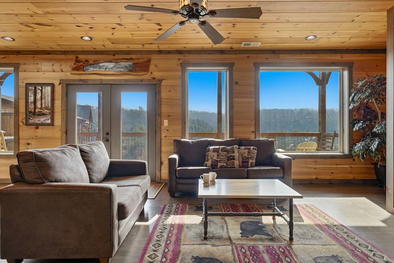<span class="name">Spacious great room w/ electric fireplace, TV, & sleeper sofa</span> <span class="name">Spacious great room w/ electric fireplace, TV, & sleeper sofa</span>