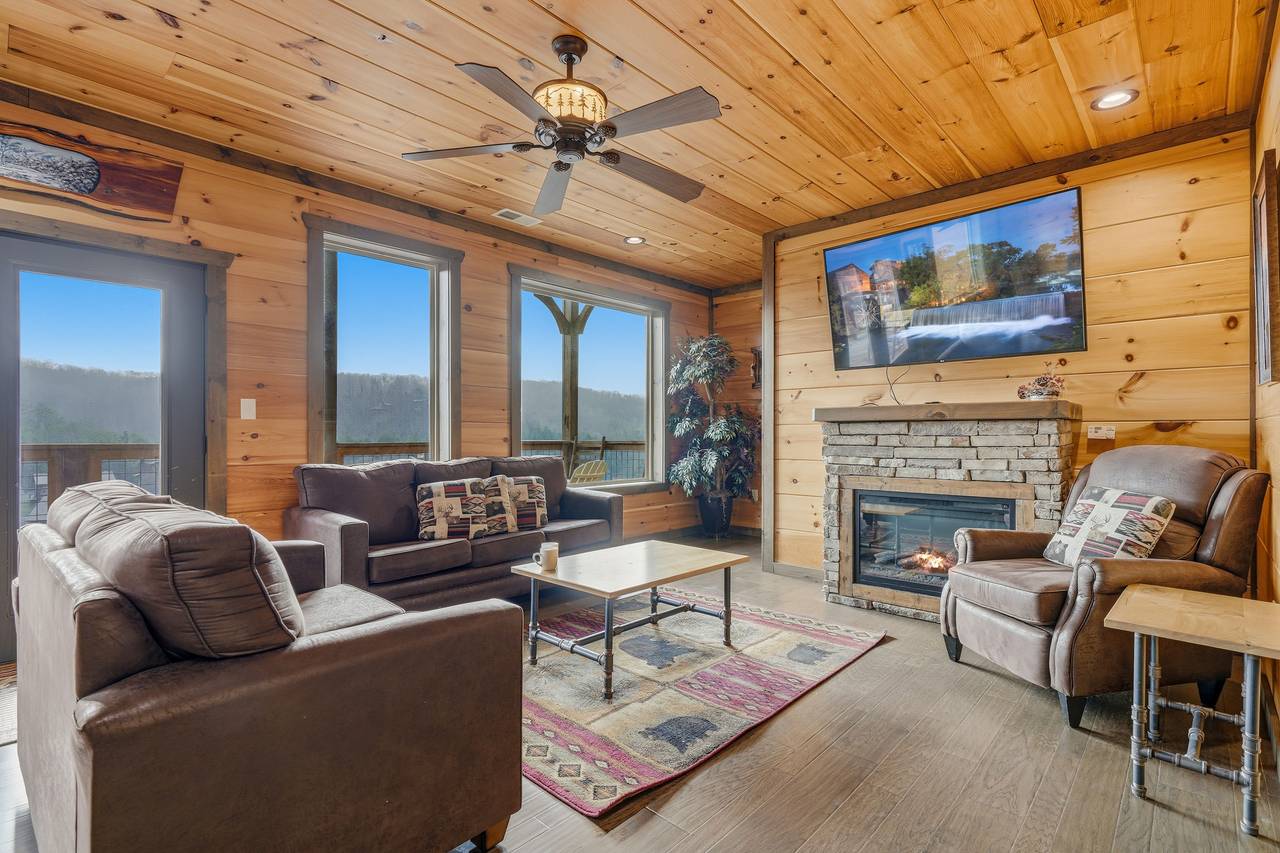 <span class="name">Spacious great room w/ electric fireplace, TV, & sleeper sofa</span> <span class="name">Spacious great room w/ electric fireplace, TV, & sleeper sofa</span>