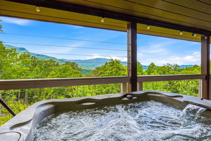 Covered hot tub deck perfect for relaxing year-round Covered hot tub deck perfect for relaxing year-round