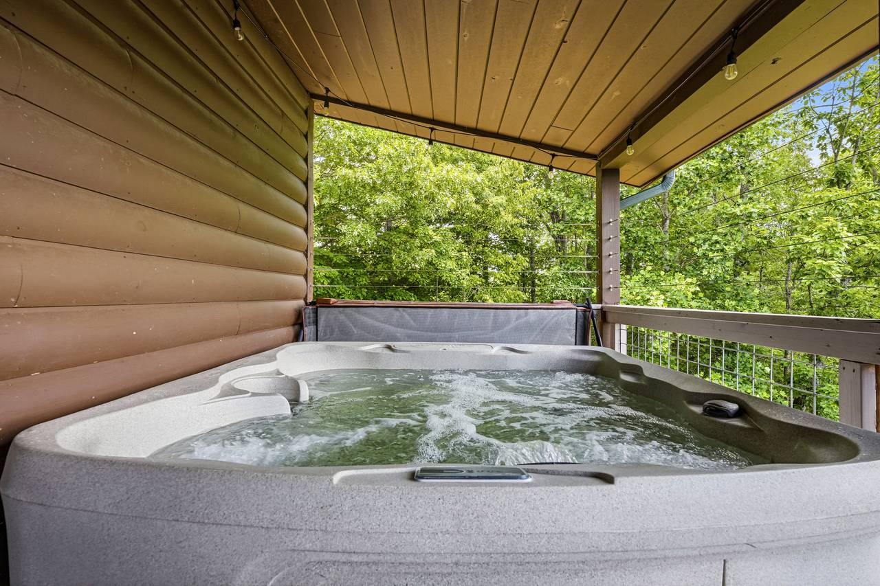Covered hot tub deck perfect for relaxing year-round Covered hot tub deck perfect for relaxing year-round