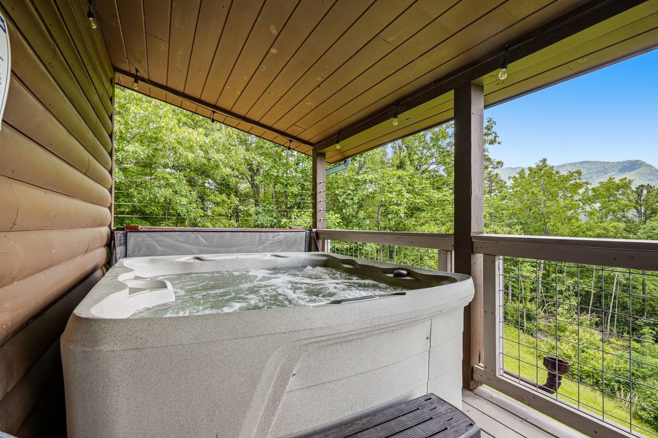 Covered hot tub deck perfect for relaxing year-round Covered hot tub deck perfect for relaxing year-round