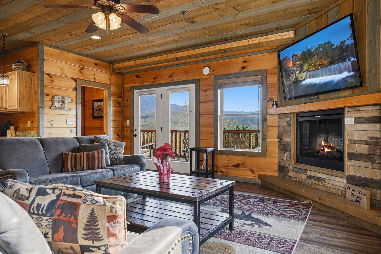Bright living space with large windows & views Bright living space with large windows & views