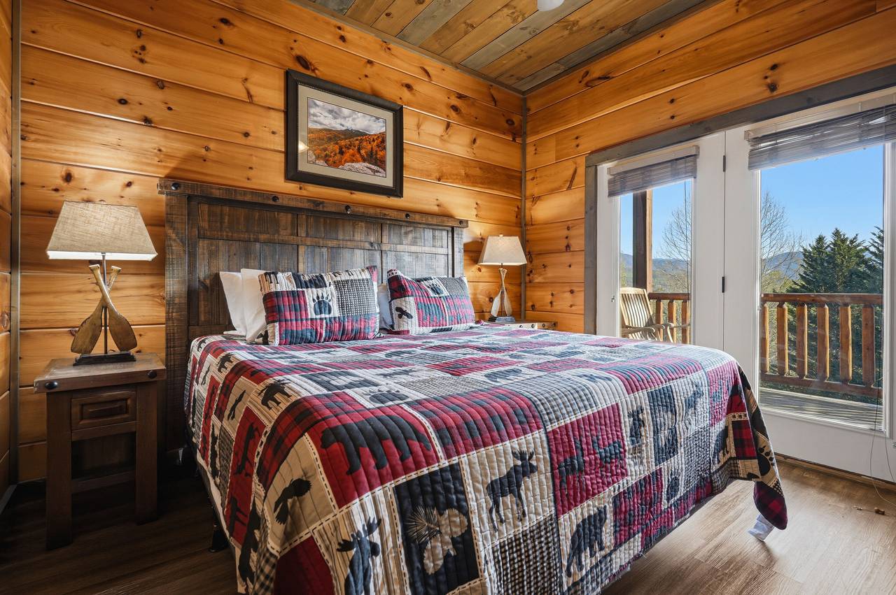 Lower level king with ensuite bath, deck access, & TV Lower level king with ensuite bath, deck access, & TV