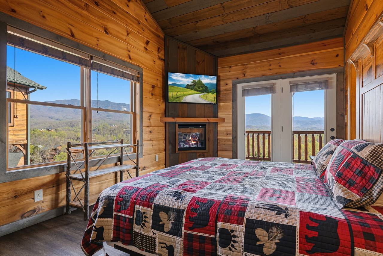 King suite with ensuite bath,TV, fireplace, & deck access King suite with ensuite bath,TV, fireplace, & deck access