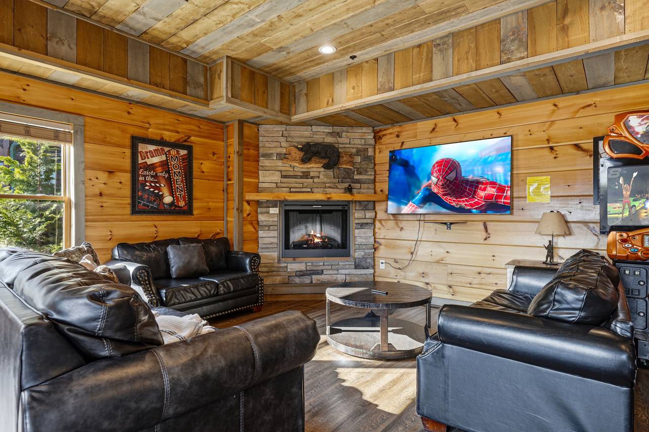 Lower level living area with sofa seating & TV Lower level living area with sofa seating & TV