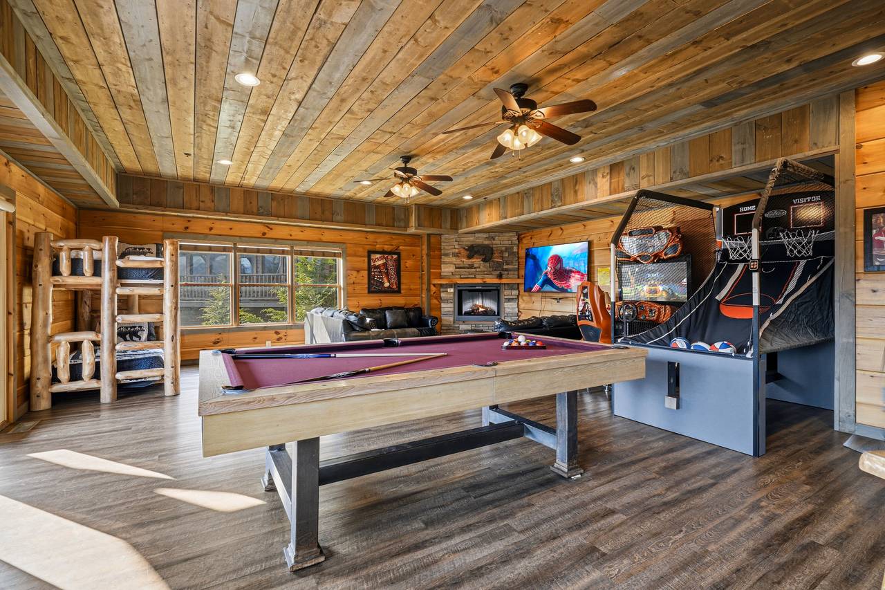 Game room with pool table & arcade fun Game room with pool table & arcade fun